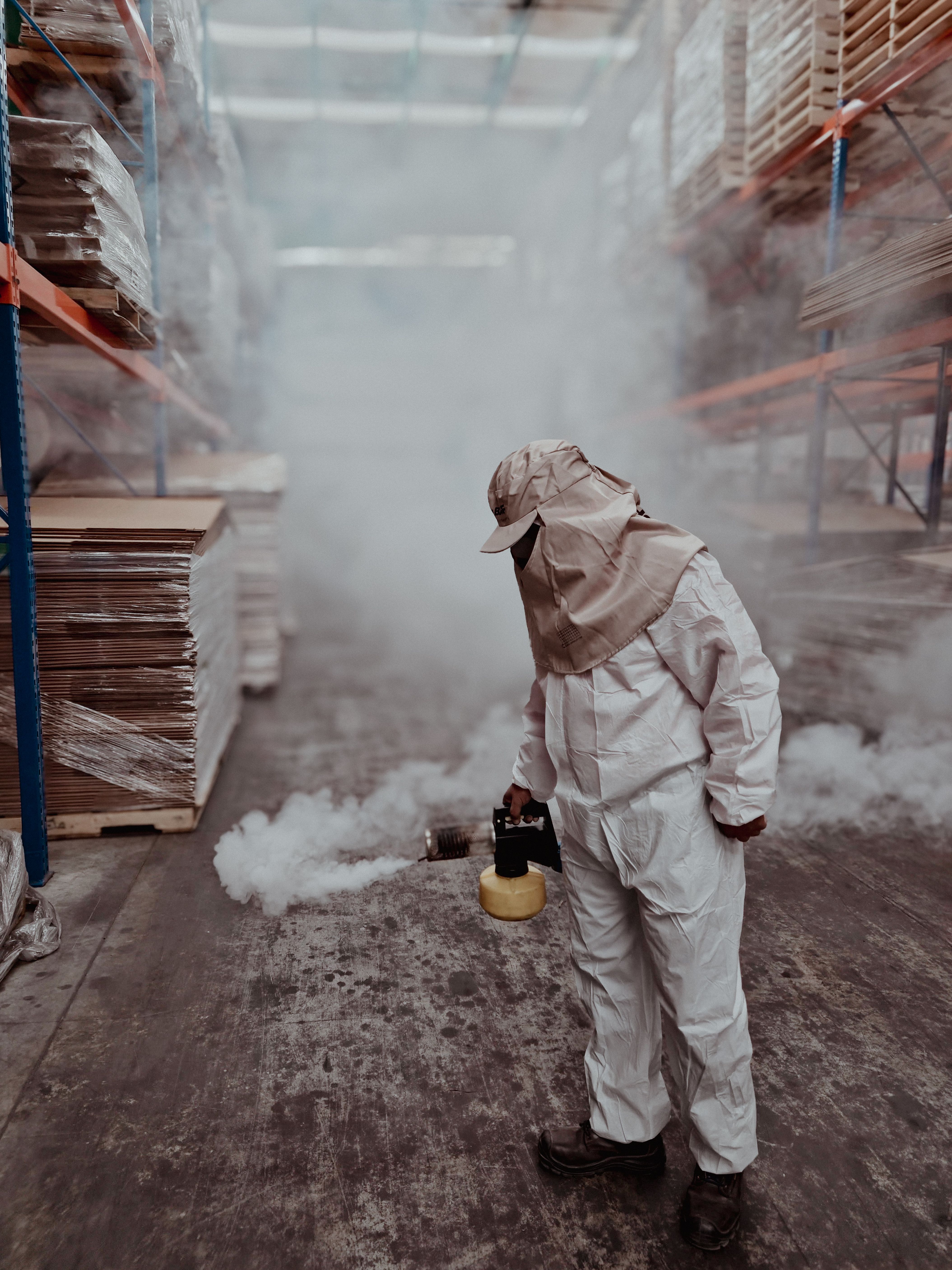 Technician fogging a warehouse